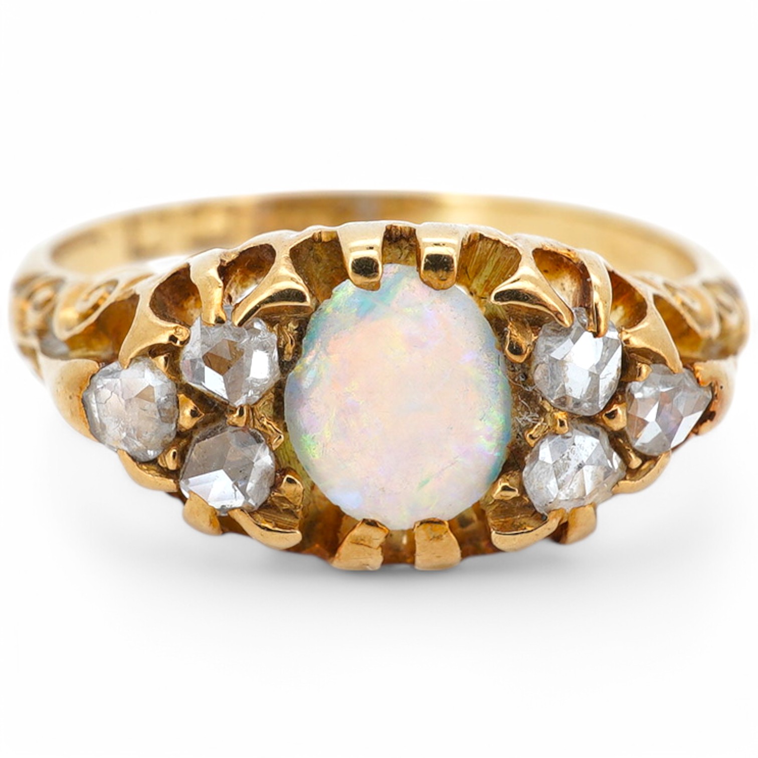 A late Victorian 18ct gold and oval white opal ring with six stone diamond set shoulders, size J, hallmarked for Birmingham, 1899, gross weight 2.5 grams. Condition - poor to fair